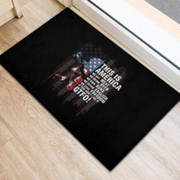 Rectangular black rubber doormat with patriotic skull graphic and 'GTFO!' text