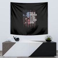 Patriotic wall tapestry showing black background with American flag design and “THIS IS AMERICA” text