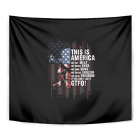 Patriotic wall tapestry close-up with black background, American flag graphic and “THIS IS AMERICA” text