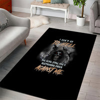 Black rectangular area rug with skull and reaper graphic and distressed gold lettering