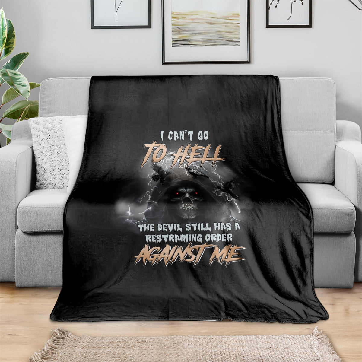 Black bat reaper blanket with stylized skull and fiery graphic text