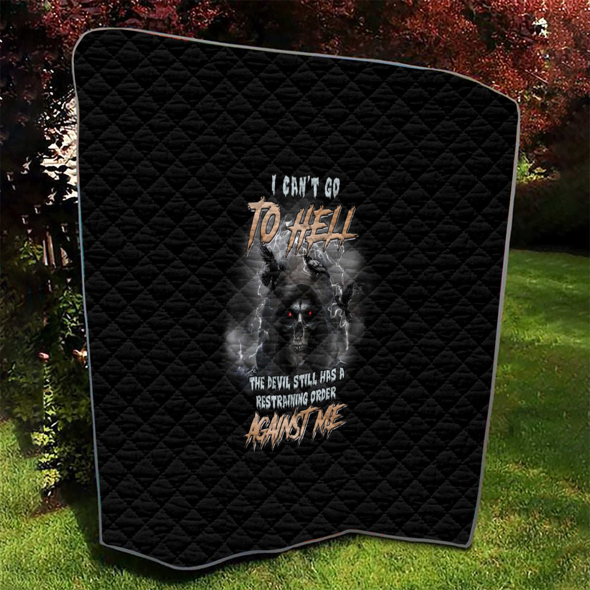 Black quilt with rounded edges, diamond quilting, and reaper skull text design