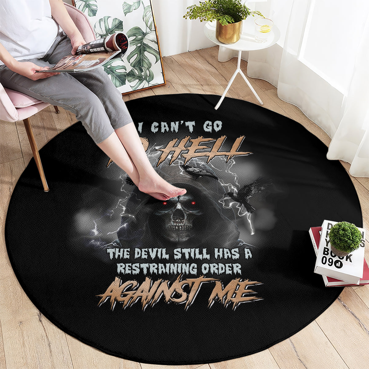 Black round carpet with skull, bat wings, and bold hell-themed typography