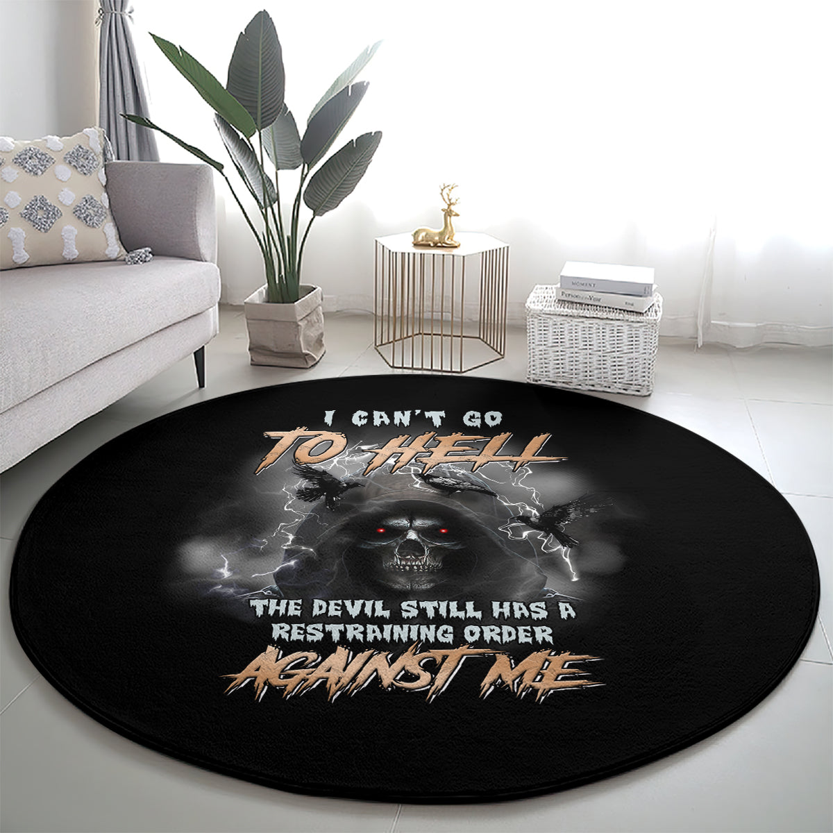 Black round carpet with skull and bat-wings print, text across the center
