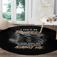 Black round carpet with skull graphic, bat wings, and restraining-order text