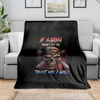 Black graphic throw blanket with skull and patriotic text, draped on sofa