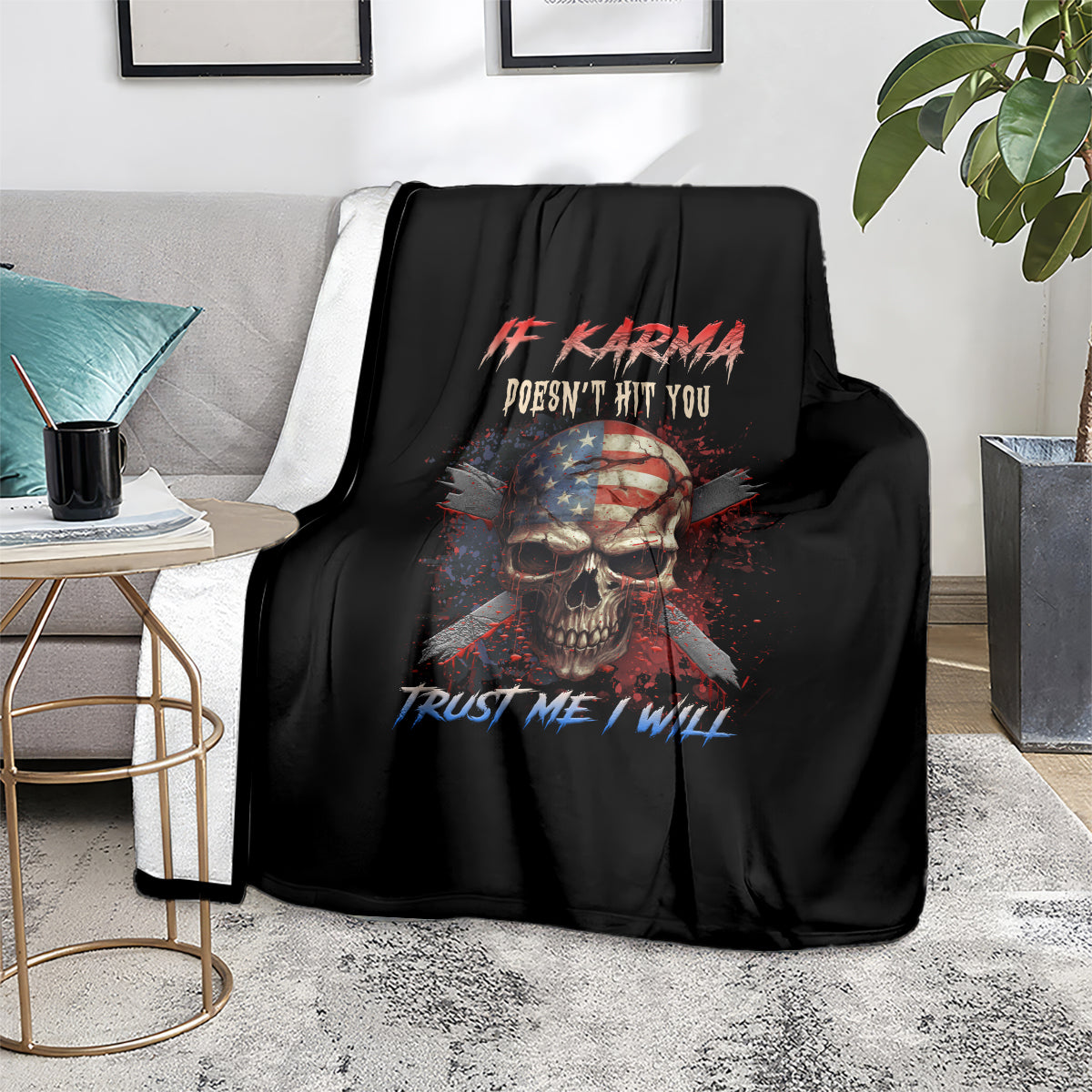 Black skull graphic throw blanket with patriotic quote, folded on sofa
