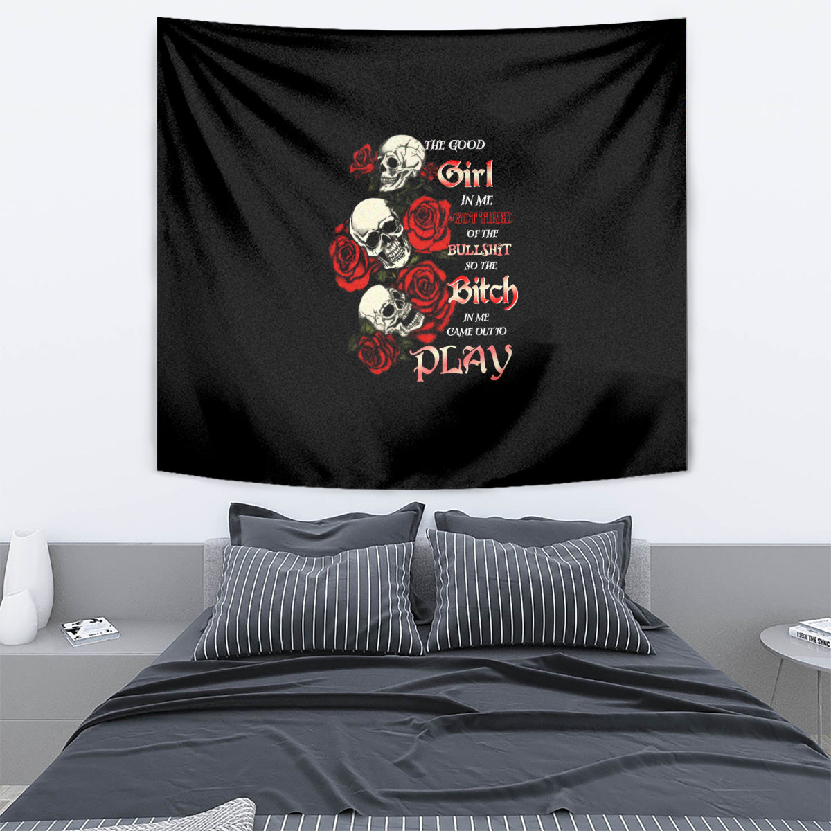 Black skull and rose tapestry with colorful text graphic, including “Play”.