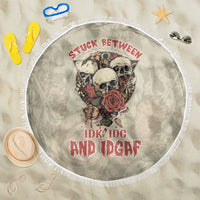 Round beach blanket, light olive, skull-and-rose print with distressed red lettering