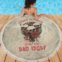 Round beach blanket with skull-and-rose center design, white fringe edge