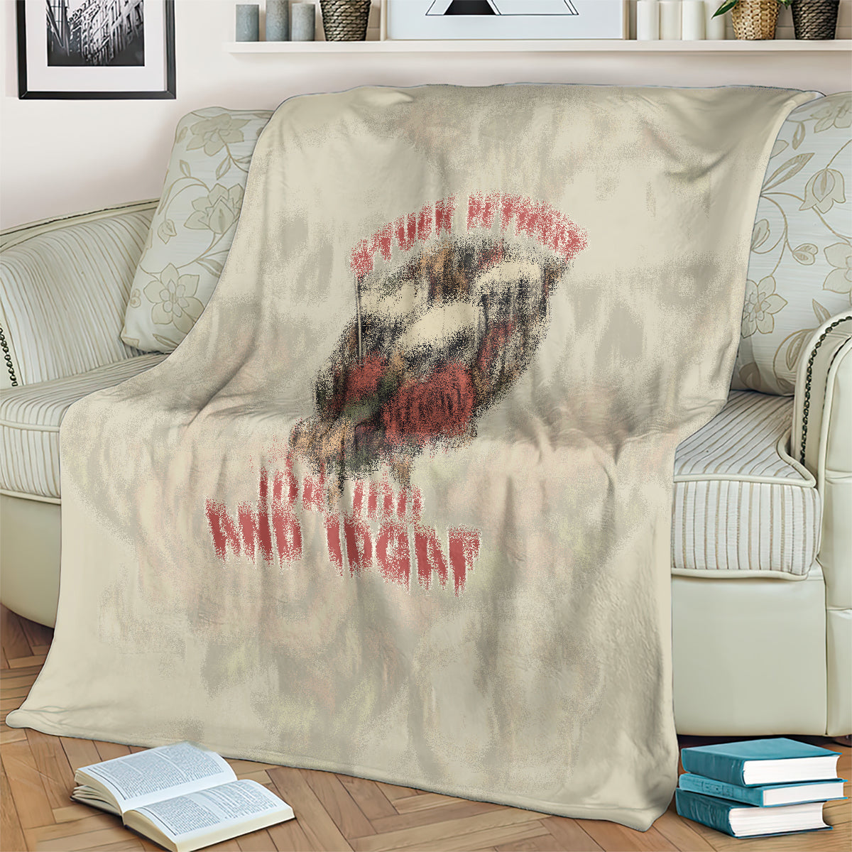 Beige skull blanket with large red-and-black face and dripping text
