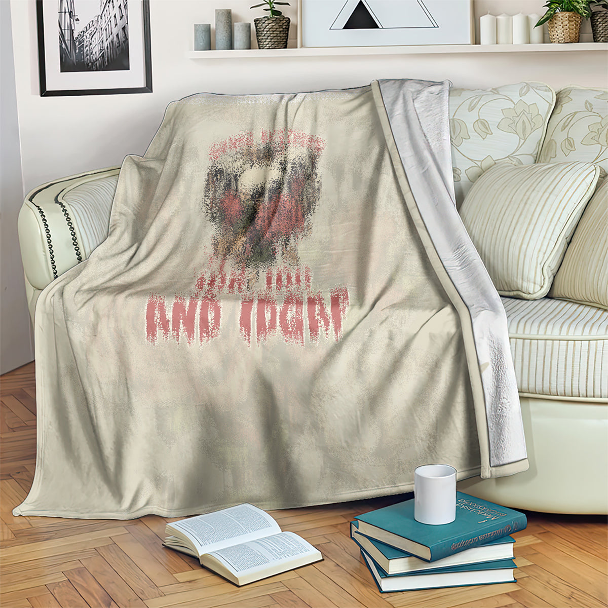 Beige skull blanket folded on sofa with red-and-black skull face print