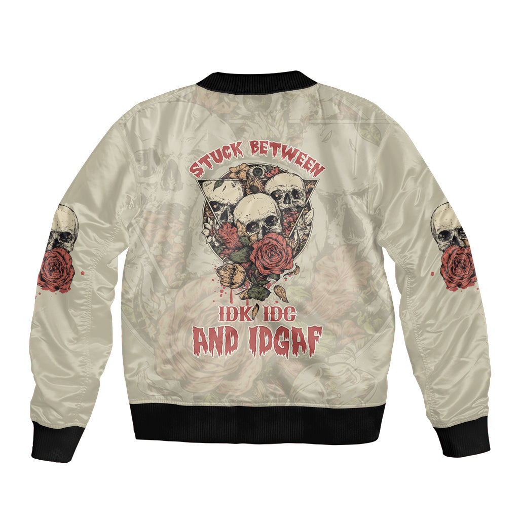 Cream bomber jacket back with large skull graphic, roses, bold text, black ribbed hem
