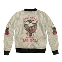 Cream bomber jacket back with large skull graphic, roses, bold text, black ribbed hem