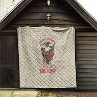 Cream quilt with skull artwork and red lettering, diamond pattern, black trim