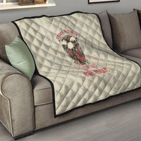 Cream quilt with black edge trim, skull artwork and red slogan, diamond quilting