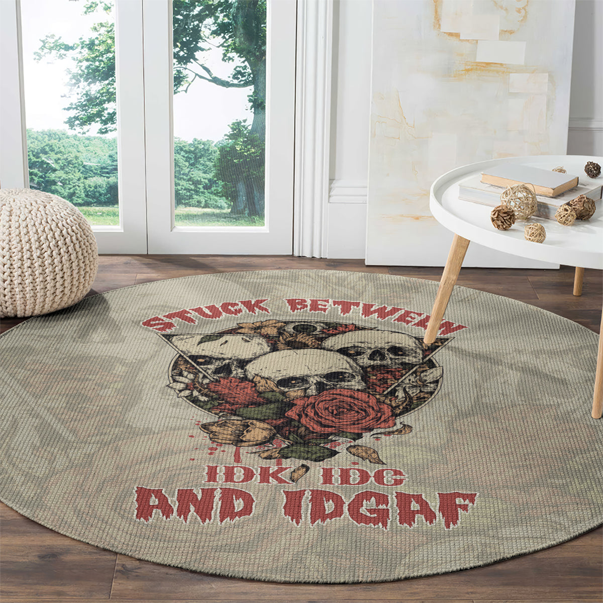 Round area rug with skull, rose, and red lettering, gray woven look