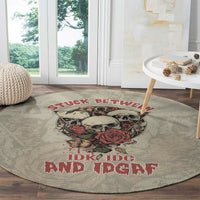 Round area rug with skull, rose, and red lettering, gray woven look