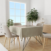 Rectangular tablecloth in light beige with a centered multicolor skull and quote print