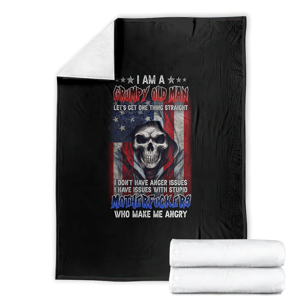 Black skull-themed graphic blanket with patriotic text, folded with rolled blankets