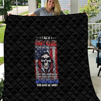 Black quilt showing diamond quilting and centered grumpy skull design in red, blue, and white