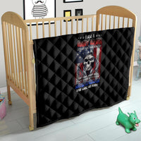 Black quilt in a baby crib with diamond quilting and centered skull graphic