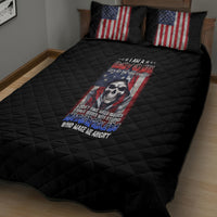 Black quilt bed set with American flag pillows and centered skull graphic