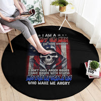 Round black rug with grumpy old man skull graphic and red-blue star flag design