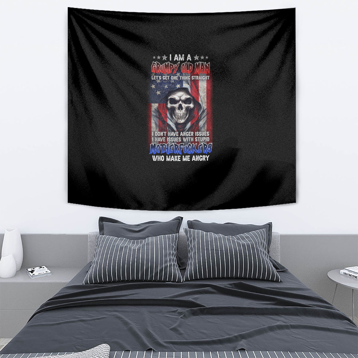 Black tapestry wall hanging with skull graphic and colorful patriotic-style text