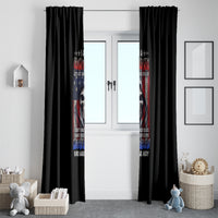 Black window curtain panels with vertical skull and multicolor slogan graphic over doorway.