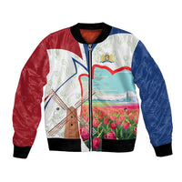 Multicolor bomber jacket with front windmill, tulips, and coat of arms graphic