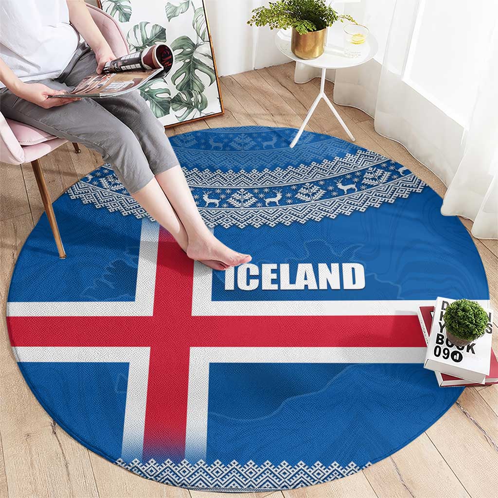 Round Iceland flag rug with red cross, ICE LAND text in center, patterned border
