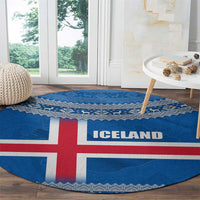 Round blue Iceland flag rug with red cross, ICE LAND center text, knit trim border