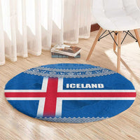 Round blue Iceland flag rug with red cross and ICE LAND lettering, Nordic patterned edge