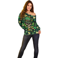 Dark green off-shoulder sweater with skull-in-hat graphic and shamrock leaf pattern