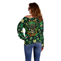 Dark green off-shoulder sweater with skull and clover leaf pattern, side view