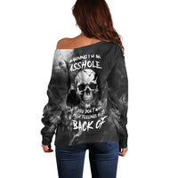 Black off-shoulder sweater back view with skull and 'back off' text