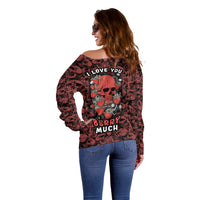 Red off-shoulder sweater with skull-and-strawberry print, side/back view
