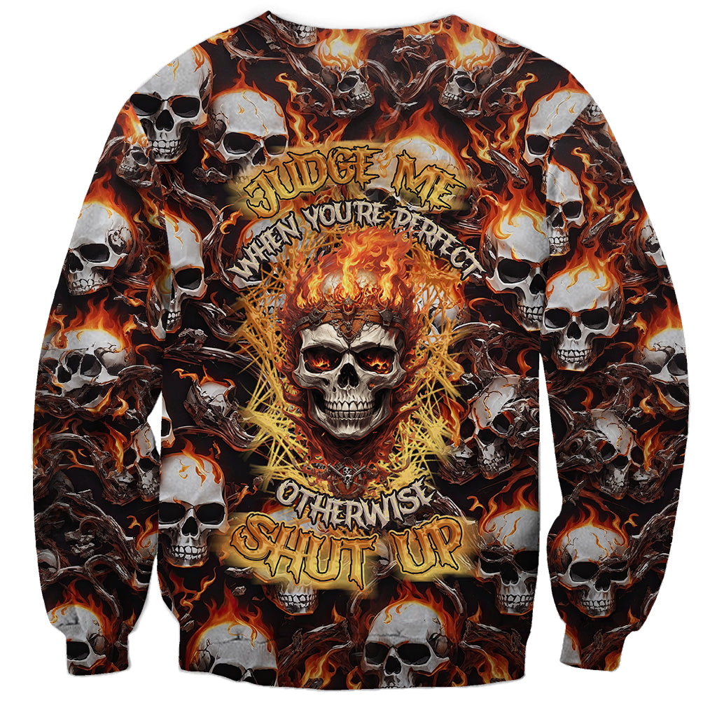 Multicolor skull flame sweatshirt with central fiery skull and arched text design.