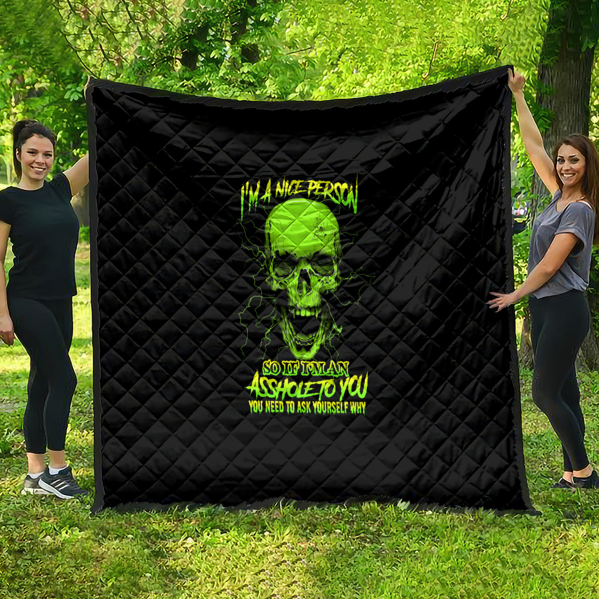 Black quilt with neon green skull graphic and diamond stitched pattern