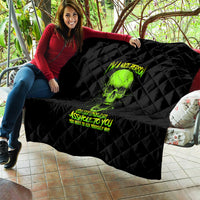 Black quilt held up with neon green skull graphic and quilted diamond texture