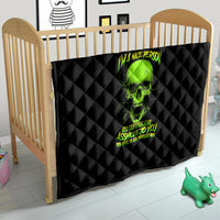 Black quilt laid on baby bed frame, neon green skull graphic, diamond quilting