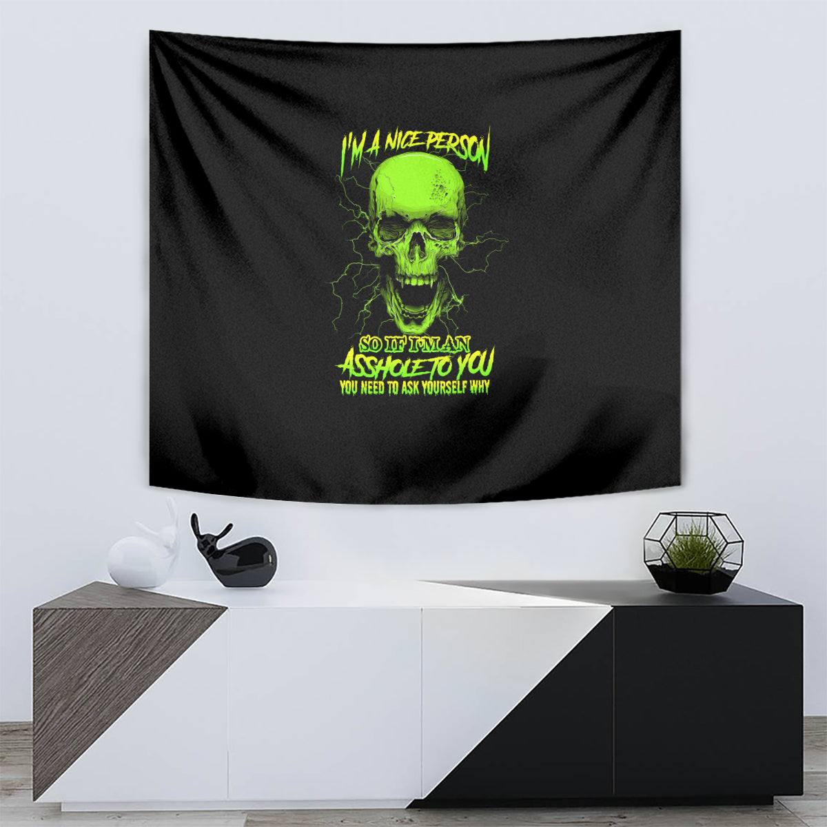 Black rectangular tapestry with neon green skull and message graphic