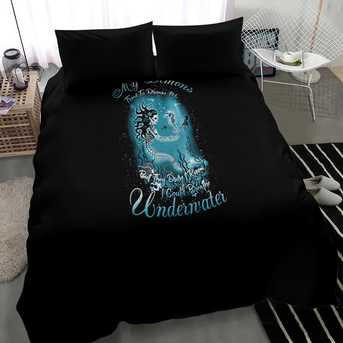 Black duvet and two pillowcases with blue mermaid illustration and Underwater text