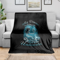 Black mermaid graphic blanket with teal text and undersea creature artwork