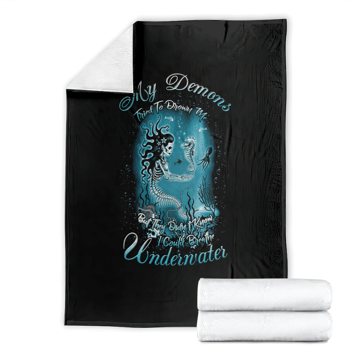 Black mermaid graphic blanket with teal undersea creature quote print, folded