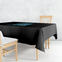 Black mermaid-themed tablecloth with blue ocean artwork on the tabletop