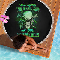 Round black beach blanket with green skull graphic and white fringe border