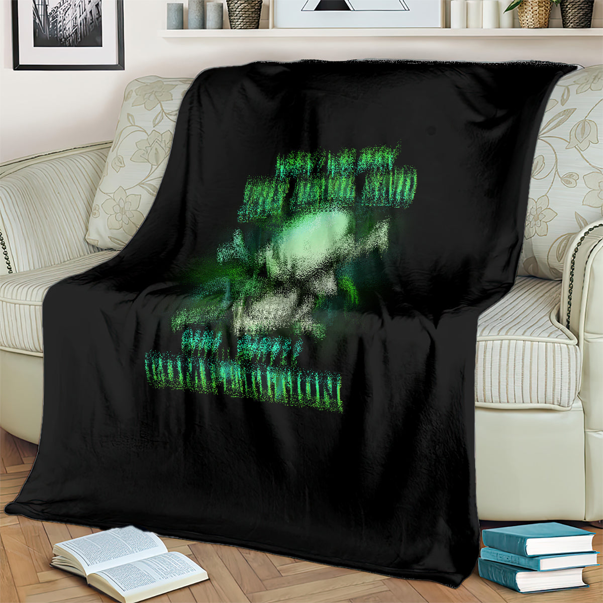 Black skull graphic blanket with neon-green words, draped on a sofa
