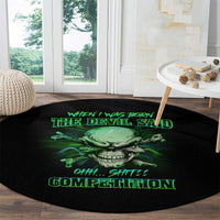 Round black rug with green skull and neon-style text graphic on wooden floor